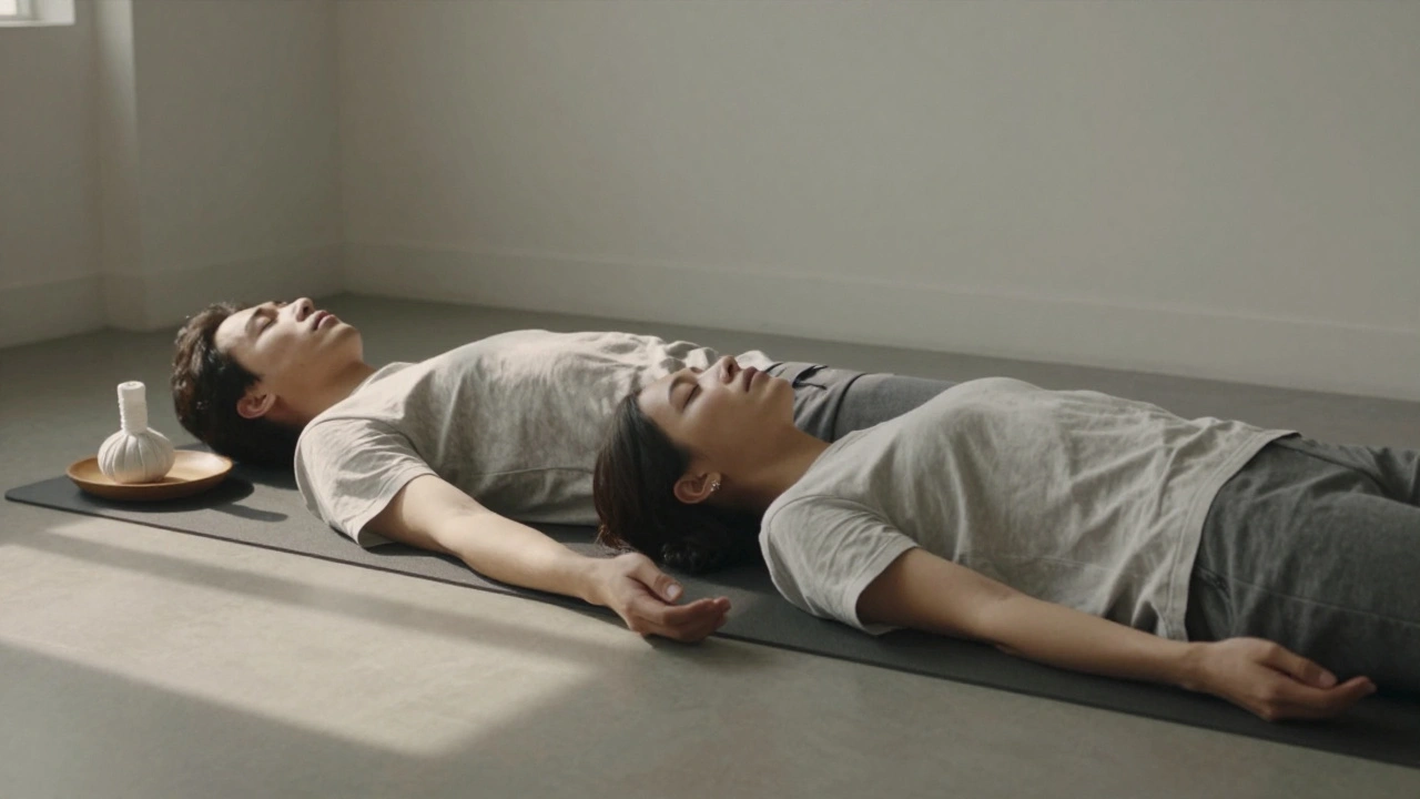 Two people relaxing side by side in quiet Thai massage studio, both clothed and at peace